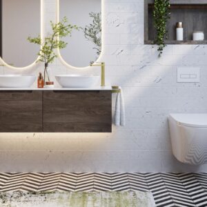 Armera bathroom featuring a floating dark wood vanity unit with double countertop basins, brushed brass fittings, marble effect brick tiles, a monochrome chevron floor, and a wall-hung toilet with recessed shelving.